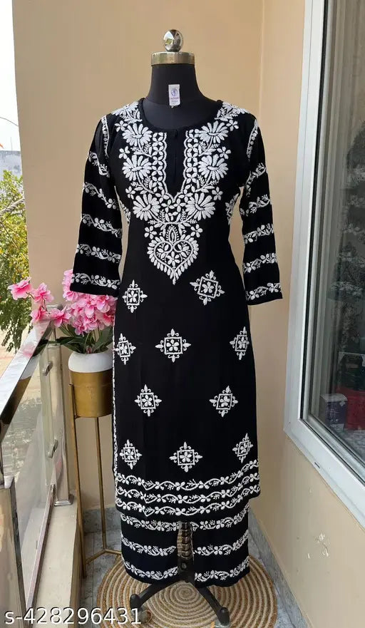 Rayon Chikankari embroidered women's kurta set with bottom, three-quarter sleeves, featuring intricate net patterns. Indian craftsmanship." (124 characters)