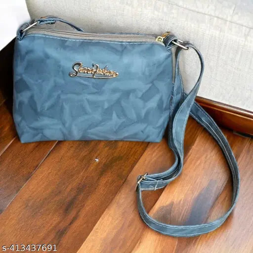MM sling bag, navy blue canvas with metallic accents and adjustable strap