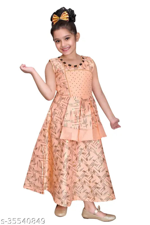Pink, peacock feather print dress with a bow in the girl's hair