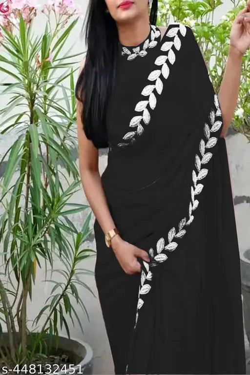 Black saree with white geometric border and pallu