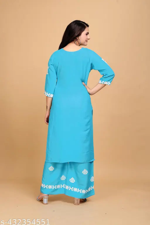 Embroidered net rayon kurta with palazzos, three-quarter sleeves, and matching bottomwear. Rayon fabric. Indian origin