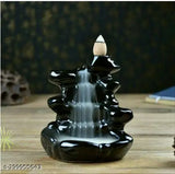 Black poly resin Kailash Parvat Smoke Fountain resembling snowfall, with free backflow incense cones for home decor. Handcrafted Indian idol showpiece for living room or drawing room