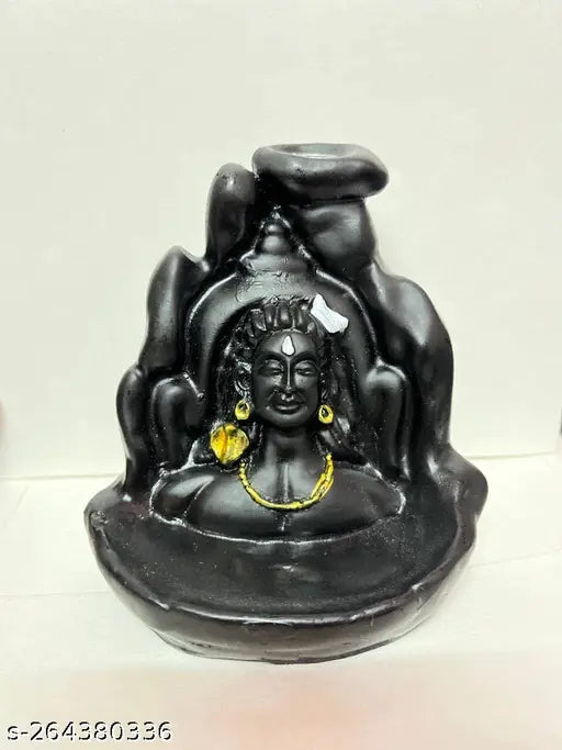 Black glass figurine of Lord Shiva with a backflow smoke fountain for incense holder, adorned in jewelry, set on a stone pedestal