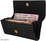 Black polka dot patterned handclutch, with zip closure and multiple card slots