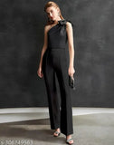 Black jumpsuit with high slits and black strappy heels