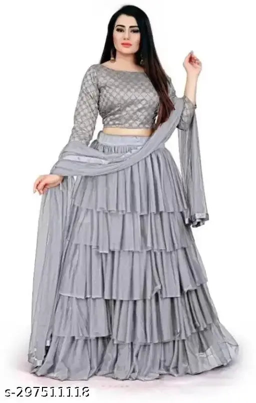 Silk blend and net embroidered lehenga with ruffle design and heavy embellishments, Kalamkari dupatta on display