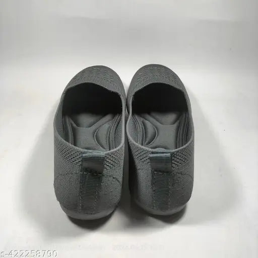 Grey woven knit shoes, flexible, comfortable, and with a padded sole.