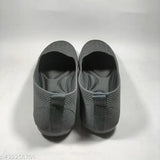 Grey woven knit shoes, flexible, comfortable, and with a padded sole.