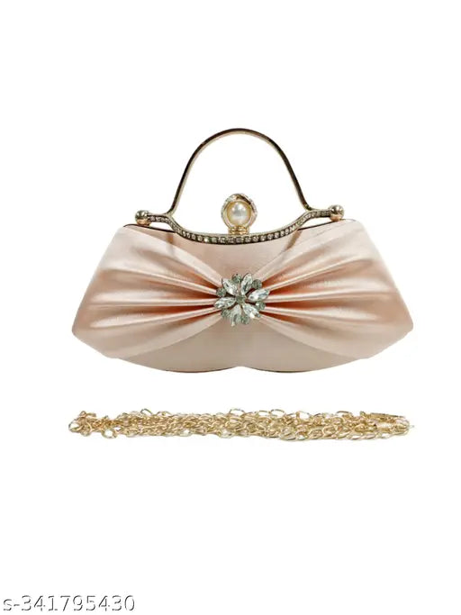 Pink satin bow clutch bag with metallic accents and braided chain strap