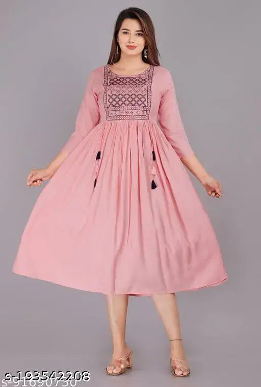 Pink rayon three-quarter sleeve solid kurti on a hanger, Indian fashion wear for women's wardrobe