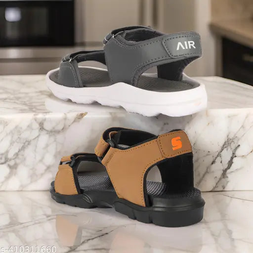 Two kids' casual sandals, one in black with white sole and the other in brown with orange trim