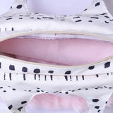 Stylish fur sling bag with pink interior, black and white fur trim