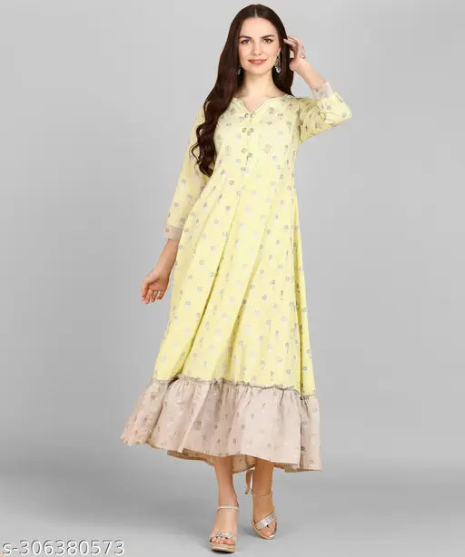 Light yellow poly-cotton A-line kurta with 3/4 sleeves, embellished with zari work. Stunning traditional wear for women by Adhisa." (119 characters)