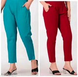 Teal cotton pants, red stretch pants, blue stretch pants, all with a zipper