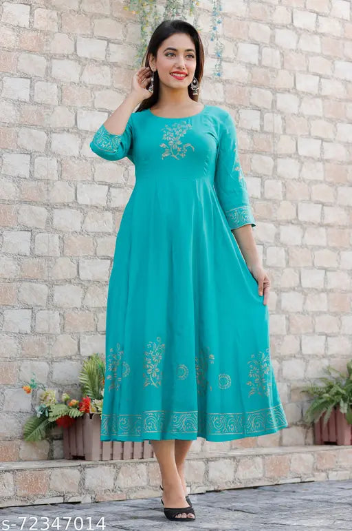 Hand block printed rayon kurta with three-quarter sleeves and gold detailing, single-color Indian traditional clothing on mannequin
