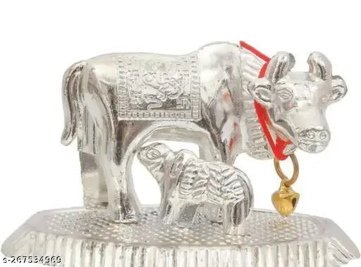 Silver Kamdhenu cow statue with calf, Indian metal figurine for home office or car dashboard decor" (104 characters)