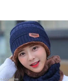 Blue knit cap with a navy lining and white logo