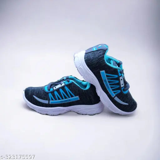 Black, white, and teal boys athletic shoe with blue accents