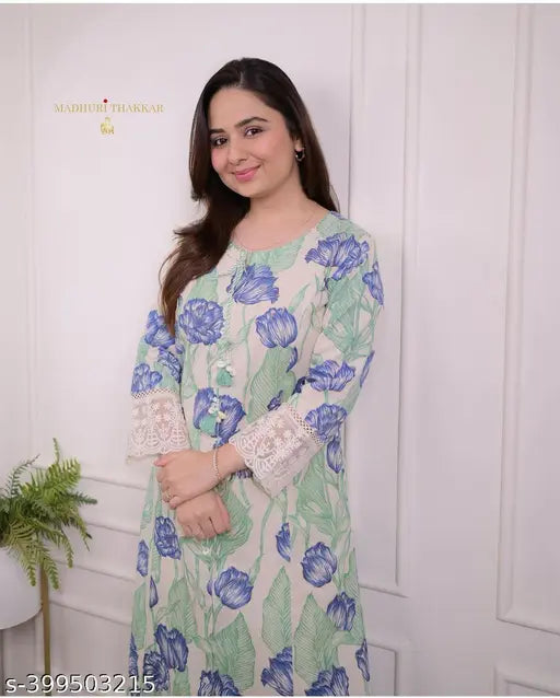 Blue women's rayon kurti set with dupatta and pants, printed net design in three-quarter sleeves on display stand