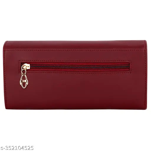 A maroon faux leather clutch with zip closure, featuring a main compartment and two phone pockets