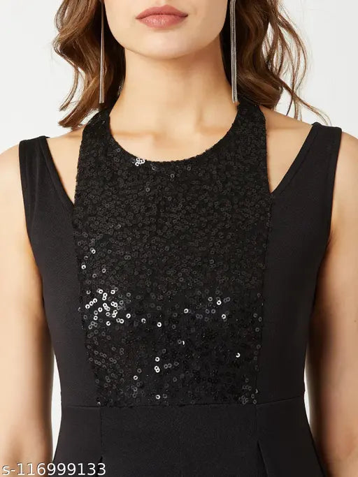 Black polyester sleeveless halter neck jumpsuit by Miss Chase, featuring sequin panel and pleats, suitable for XS to XL sizes