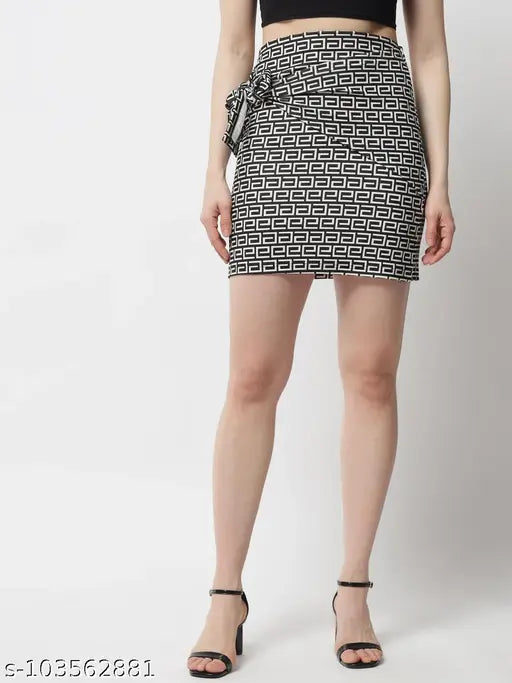 Printed black and off-white polyester pencil skirt by POPWINGS. Fitted mini skirt with knot on right side for captivating date night wear, size M (waist 26in, length 19in, hip 32in). Made in India