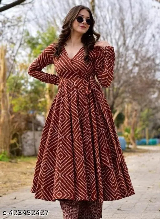 Maroon rayon anarkali gown and pant set with three-quarter sleeves, printed net pattern on display