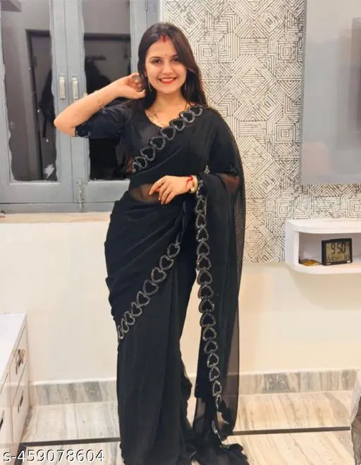 Black sari with intricate designs, suitable for formal events