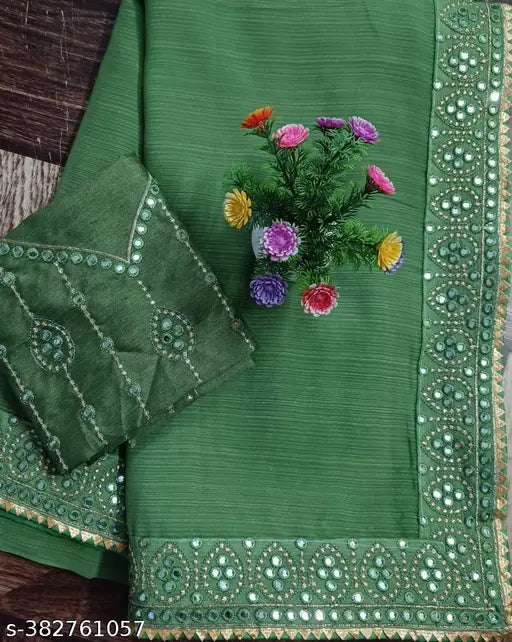 Green and gold embroidered women's saree, traditional style