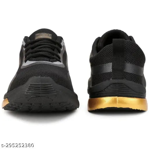 Black and grey running shoes with black straps, yellow accents, and white soles