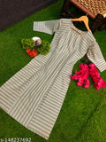 Premium cotton kurta on a mannequin, displayed on a green carpet with flowers