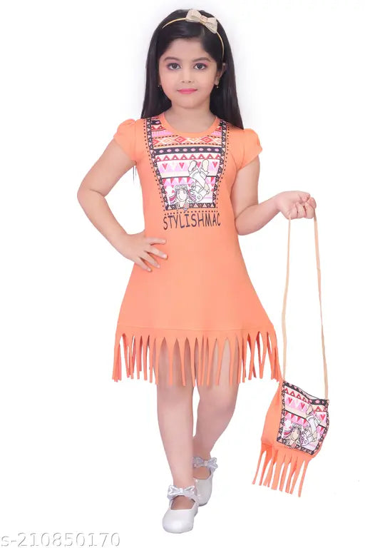 Girl wearing an orange sundress with a fringe detail and matching handbag