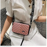 Hot pink sling bag with zipped closure, adjustable strap