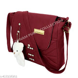 Maroon fabric satchel, zip closure with keychain, tassel trim