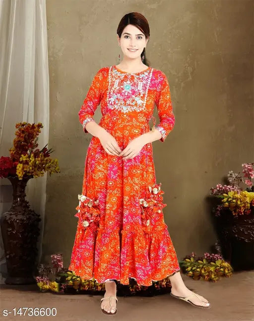 Printed rayon kurti with puff sleeves, embellished neckline and flared skirt" # visually rich details about garment material & design features