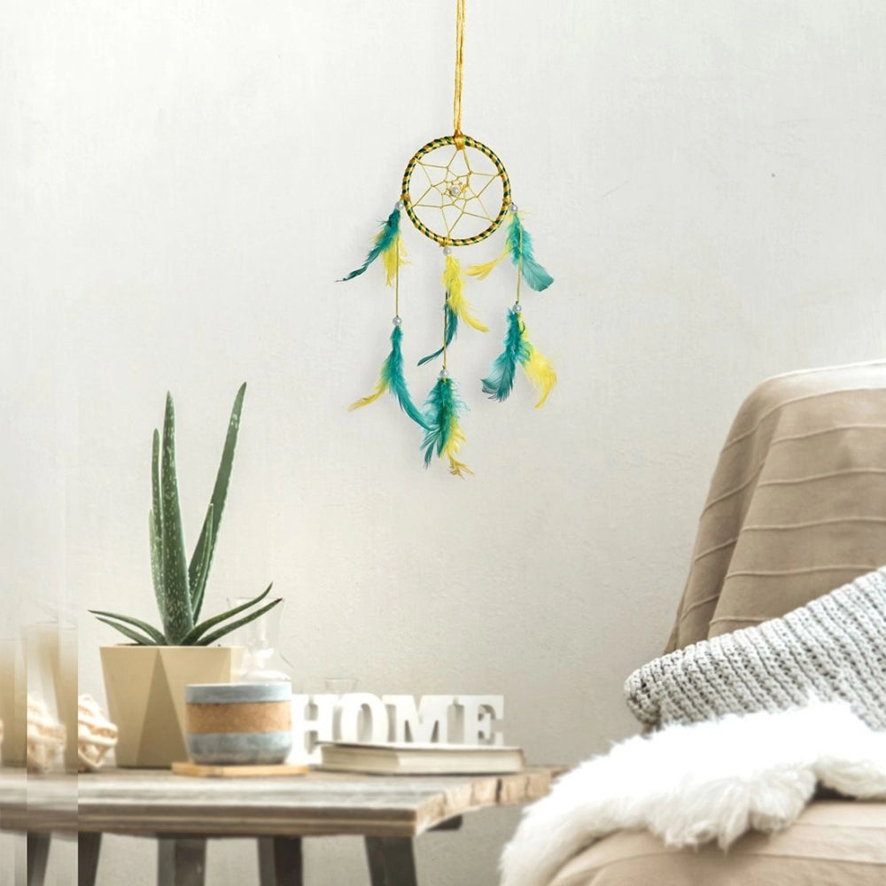 Yellow dream catcher with feather detail on white background