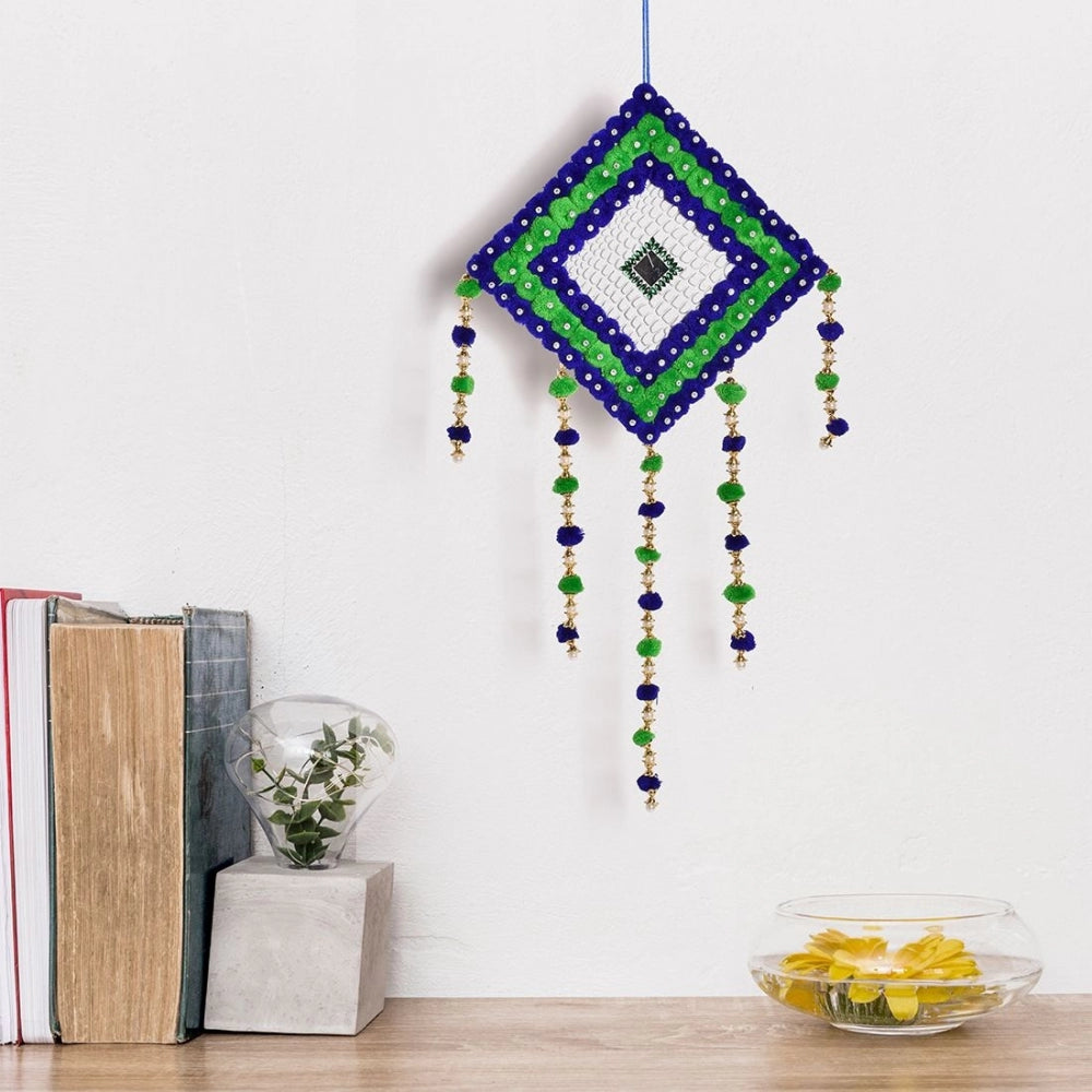 Blue and green handcrafted wall hanging with tassel