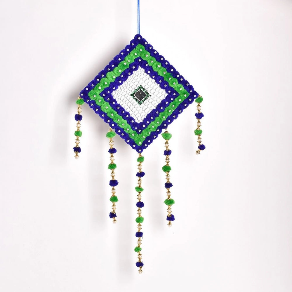 Multicolored handmade wall art with blue, green and white pompoms