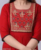 Maroon embroidered kurti. Cotton fabric, detailed floral embroidery, A-line silhouette.