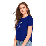 A person wearing a royal blue t-shirt with an emblem on the front