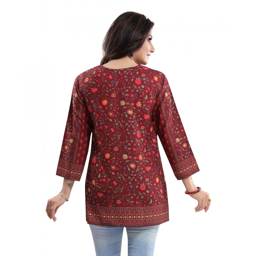 Red faux crepe printed short kurti tunic top for women, casual occasion wear on model