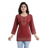 Red faux crepe printed short kurti tunic top for casual wear