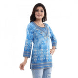 Sky blue faux crepe printed short kurti tunic top for women's casual wear, quarter sleeve length with vibrant pattern detail