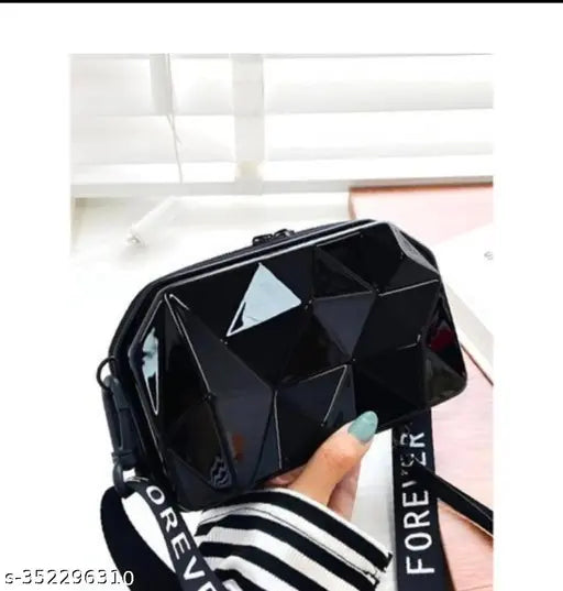 Mini black crossbody sling bag with cutout design, stitching detail