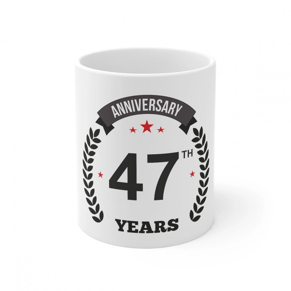 Ceramic mug with printed anniversary message and laurel wreath design