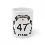 Ceramic mug with printed anniversary message and laurel wreath design