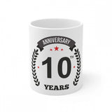 White ceramic mug with printed anniversary design and '10th Anniversary' inscription