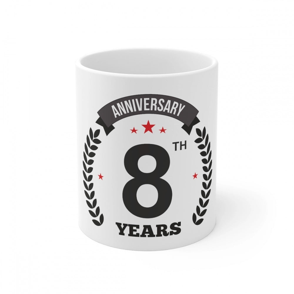 A white ceramic mug with an anniversary print and 330ml capacity