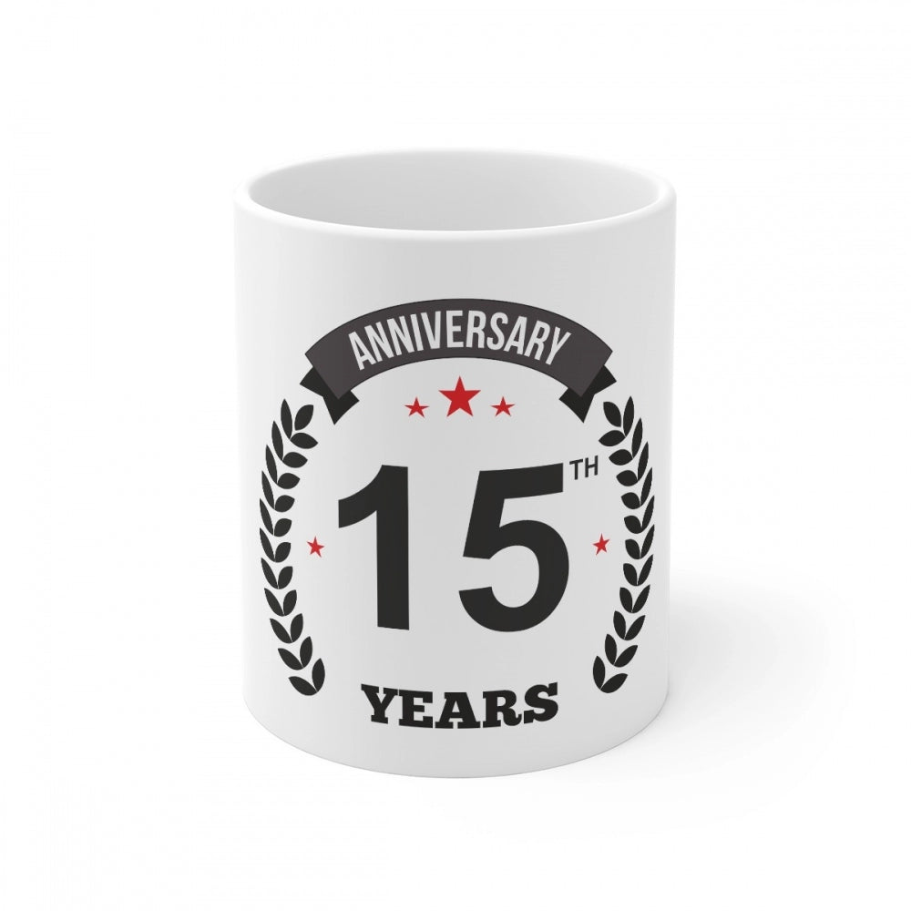 White ceramic coffee mug with black print celebrating 15 years