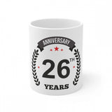 White ceramic coffee mug with a printed design and "Anniversary 26th" text. 330ml capacity